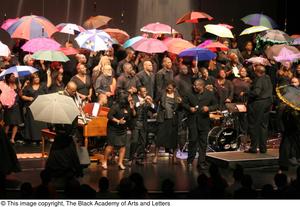 [Large Ensemble on Stage with Umbrellas]