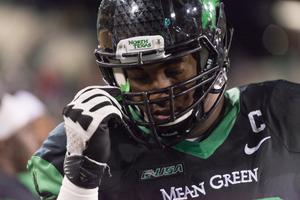 [Mean Green Football Player in Game Gear]