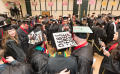 Primary view of [Colorful Graduation Caps at the Fall 2014 Undergraduate Commencement Ceremony]