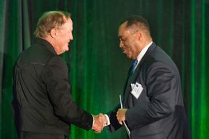 [Presenters shake hands at the Mayborn Conference]