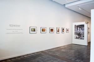[Exhibit Wall With Photographs]