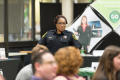 Primary view of [Police officer standing at the LGBTQIA Career Fair]