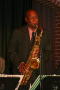 Photograph: [Saxophonist playing on stage]