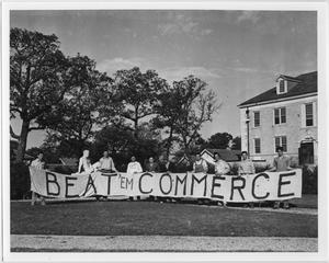 [Students with Homecoming banner, 1941]