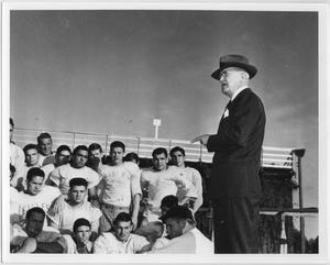 [North Texas President W. J. McConnell addresses football team during Homecoming, 1941]