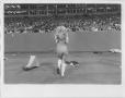 Primary view of [North Texas State University Cheerleader at a Game]