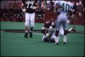 Photograph: [North Texas Football Player Tackles an Aggie, 1991]