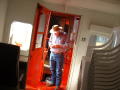 Photograph: [Man standing in doorway of train car]