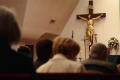 Photograph: [Congregants see the crucifix over the alter]