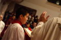 Primary view of [Altar boy is seen during the service]