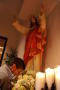 Thumbnail image of item number 1 in: '[Parishioner prays under statue of Jesus]'.