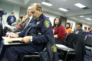 [Officer of Dallas County Sheriff's Office in audience]
