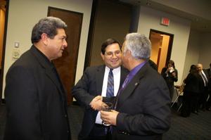 [Three attendees at the North Texas Latino Council Meeting]