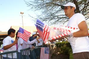 [Man gives American flags to immigration protesters]