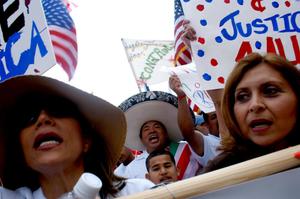 [Immigration Protesters, Signs, and American Flags]