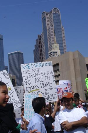 [Sign reads, in part, "We Mexicans are not immagrents we are on our home...']