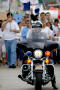 Thumbnail image of item number 1 in: '[Close-up view of police officer on motorcycle]'.
