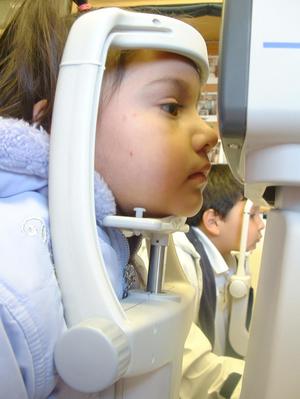 [Little boy and girl having an eye exam]