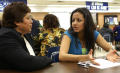 Photograph: [Students and parents talk at a meeting]