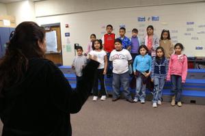 [Students listen to their instructor at Crockett Elementary]