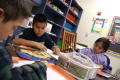 Thumbnail image of item number 1 in: '[Students concentrate on their drawings at Crockett Elementary]'.