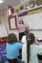 Photograph: [Teacher conducts class in Crockett Elementary]