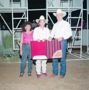 [Three people in Youth division award presentation at Will Rogers Coliseum]