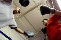 Photograph: [View from below of girl in boxing practice with instructor]