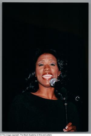 Primary view of object titled '[Tanya Blount sings into mic]'.